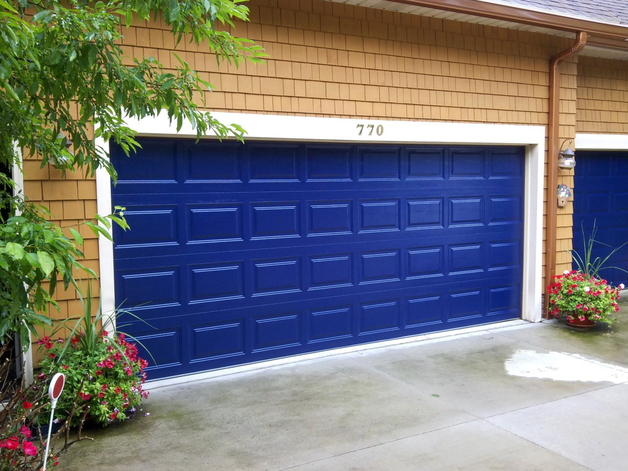 Blue garage door after J&M Doors