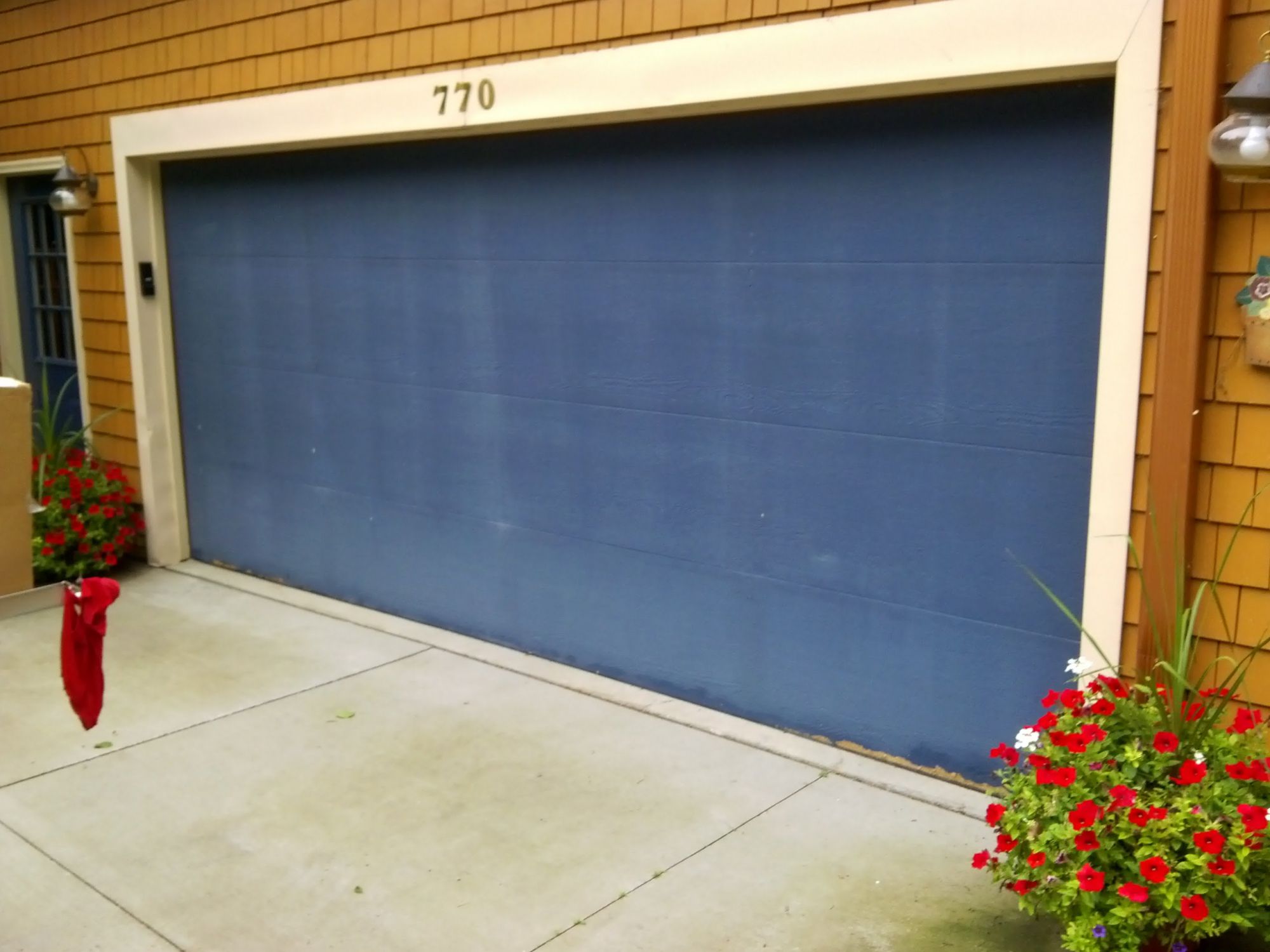 Blue garage door before J&M Doors