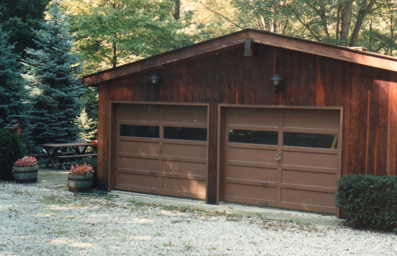 Brown garage door before J&M Doors